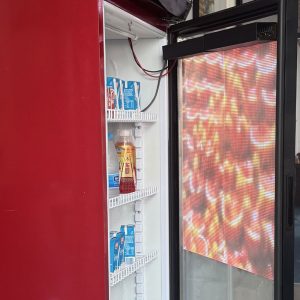 Transparent LED Film Screen – Crystal Clear Flexible LED Display for Mall Refrigerator Doors